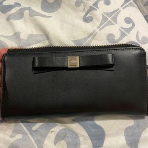 Black leather Kate Spade wallet with front bow detail